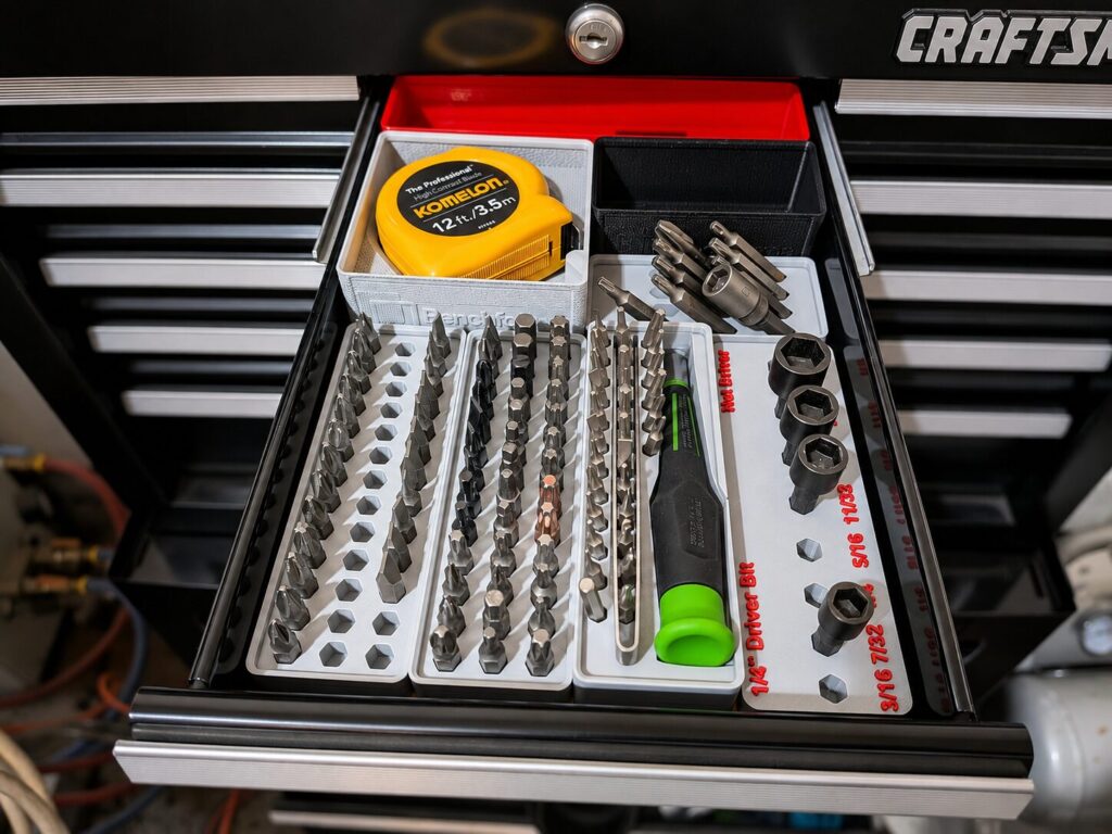Small Toolbox drawer organized with Girdfinity bins and containers, placed on Benchforma Baseplates